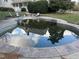 Outdoor pool needs cleaning, surrounded by stone and lounge chairs, near home at 40 Farrells Creek Rd, Apex, NC 27523