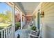 Inviting porch with rocking chairs and hanging plants, perfect for enjoying the peaceful surroundings at 40 Farrells Creek Rd, Apex, NC 27523
