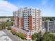 An aerial view of a mixed-use building featuring a combination of residential units and commercial space at 400 W North St # 1420, Raleigh, NC 27603