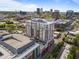 Stunning aerial view of a modern high-rise apartment building within a vibrant city skyline at 400 W North St # 1420, Raleigh, NC 27603