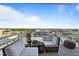 Relax on this condo balcony and enjoy the views of the surrounding cityscape and beautiful blue sky at 400 W North St # 1420, Raleigh, NC 27603