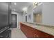 Bathroom featuring a granite countertop, double sinks, and modern fixtures at 400 W North St # 1420, Raleigh, NC 27603