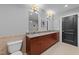 Bathroom featuring granite countertops, double sinks, modern fixtures, and a tiled backsplash at 400 W North St # 1420, Raleigh, NC 27603
