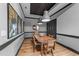 An elegant dining room with hardwood floors, stylish lights, and a tray ceiling at 400 W North St # 1420, Raleigh, NC 27603