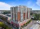 Striking exterior view of a high-rise building with red awnings, offering urban living at 400 W North St # 1420, Raleigh, NC 27603