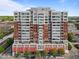 Stately exterior elevation of a high-rise featuring red accents, offering prime urban living at 400 W North St # 1420, Raleigh, NC 27603
