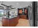 Modern kitchen with stainless steel appliances and granite counters, flowing into the living area at 400 W North St # 1420, Raleigh, NC 27603