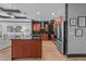 Modern kitchen featuring stainless steel appliances, granite countertops, and wood floors at 400 W North St # 1420, Raleigh, NC 27603