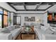 Living room with hardwood floors and coffered ceilings with access to the kitchen and bedroom at 400 W North St # 1420, Raleigh, NC 27603