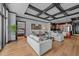 Bright living room boasts stylish coffered ceilings, hardwood floors, and a seamless flow into the modern kitchen at 400 W North St # 1420, Raleigh, NC 27603