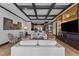 Open-concept living room with hardwood floors, tray ceilings, and modern décor at 400 W North St # 1420, Raleigh, NC 27603