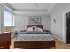 This primary bedroom features hardwood floors, a large window for lots of natural light, and a modern platform bed at 400 W North St # 1420, Raleigh, NC 27603