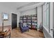 Inviting office space with a cozy chair, stylish bookshelf and ample natural light at 400 W North St # 1420, Raleigh, NC 27603