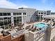 Luxury rooftop pool with lounge chairs, tables, and a grilling area, perfect for relaxing and entertaining at 400 W North St # 1420, Raleigh, NC 27603