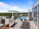 Beautiful rooftop pool with lounge chairs and a pergola overlooking the city from this fantastic building at 400 W North St # 1420, Raleigh, NC 27603