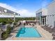 Relaxing rooftop pool with lounge chairs and dining tables, perfect for enjoying the outdoors in this building at 400 W North St # 1420, Raleigh, NC 27603