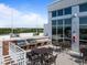 Rooftop outdoor dining area with grills and tables with tree views and outdoor kitchen at 400 W North St # 1420, Raleigh, NC 27603