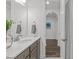 Bright bathroom featuring a sleek vanity with quartz counters and modern fixtures at 421 Raven Cliff St, Apex, NC 27523