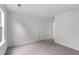 Bedroom featuring neutral carpet, white trim, and a window with natural light at 421 Raven Cliff St, Apex, NC 27523