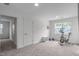 Bonus room featuring neutral carpet, white trim, and a window with natural light at 421 Raven Cliff St, Apex, NC 27523