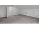 Bright bonus room featuring neutral carpet, white trim, and ample storage at 421 Raven Cliff St, Apex, NC 27523