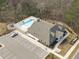 Overhead shot of a well-maintained community pool with parking, lounging, and social areas at 421 Raven Cliff St, Apex, NC 27523