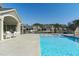 Inviting community pool with crystal-clear water and ample seating for residents to relax and socialize at 421 Raven Cliff St, Apex, NC 27523