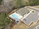 Relaxing community pool with sun loungers, seating area, and ample parking spaces nearby at 421 Raven Cliff St, Apex, NC 27523
