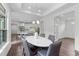 Bright dining room featuring modern chandelier and easy access to the kitchen at 421 Raven Cliff St, Apex, NC 27523