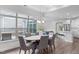 Bright dining room with views to the backyard and an open floor plan to the living room at 421 Raven Cliff St, Apex, NC 27523