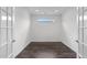 Bright, light-filled office space with dark laminate floors and white trim at 421 Raven Cliff St, Apex, NC 27523