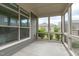 Screened-in patio with gray siding and views of the backyard at 421 Raven Cliff St, Apex, NC 27523