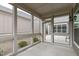 Screened-in patio with gray siding and views of the backyard at 421 Raven Cliff St, Apex, NC 27523