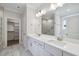 Elegant bathroom with double vanity, marble countertops, large mirror, and a walk-in shower at 4897 Grosbeak Ct, Mebane, NC 27302
