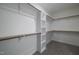 Walk-in closet with custom shelving and ample storage space at 4897 Grosbeak Ct, Mebane, NC 27302