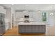 Modern kitchen with a large island, stainless steel appliances, and plenty of counter space at 4897 Grosbeak Ct, Mebane, NC 27302
