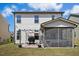 Expansive backyard featuring green grass, outdoor seating around a fire pit, pergola, screened porch, and a view of the house at 509 Rose Creek Ct, Zebulon, NC 27597