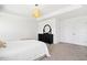 Bright bedroom with tray ceiling, and black dresser with decorative mirror at 509 Rose Creek Ct, Zebulon, NC 27597