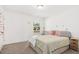 Comfortable bedroom with plush neutral carpet and bright natural light at 509 Rose Creek Ct, Zebulon, NC 27597