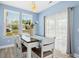 Bright dining area with a wooden table and chairs, and sliding glass doors at 509 Rose Creek Ct, Zebulon, NC 27597