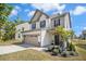 Attractive home showcasing a well-maintained lawn and a two-car garage at 509 Rose Creek Ct, Zebulon, NC 27597