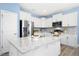 Modern kitchen with white cabinets, stainless steel appliances, and granite countertops at 509 Rose Creek Ct, Zebulon, NC 27597
