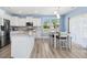 Open kitchen with stainless appliances, granite countertops, and an adjacent dining area at 509 Rose Creek Ct, Zebulon, NC 27597