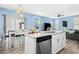 Bright kitchen with stainless appliances, granite countertops, and open to living area at 509 Rose Creek Ct, Zebulon, NC 27597