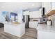 Stylish kitchen with white cabinetry, gray backsplash, and stainless steel appliances at 509 Rose Creek Ct, Zebulon, NC 27597