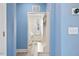 Inviting laundry room with modern washer and dryer, built-in bench, shelving, and storage space in a brightly lit area at 509 Rose Creek Ct, Zebulon, NC 27597