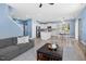 Open-concept living room with comfortable seating and a modern kitchen at 509 Rose Creek Ct, Zebulon, NC 27597
