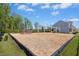 Community playground area with modern play equipment, wood chip ground cover, and well-maintained green space at 509 Rose Creek Ct, Zebulon, NC 27597