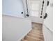 Bright staircase features carpeted steps and railing leading to upper level with decorative wall accents and natural light from the window at 509 Rose Creek Ct, Zebulon, NC 27597
