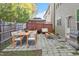 Backyard featuring a stone patio with outdoor furniture and a gas grill at 5417 Razan St, Raleigh, NC 27616
